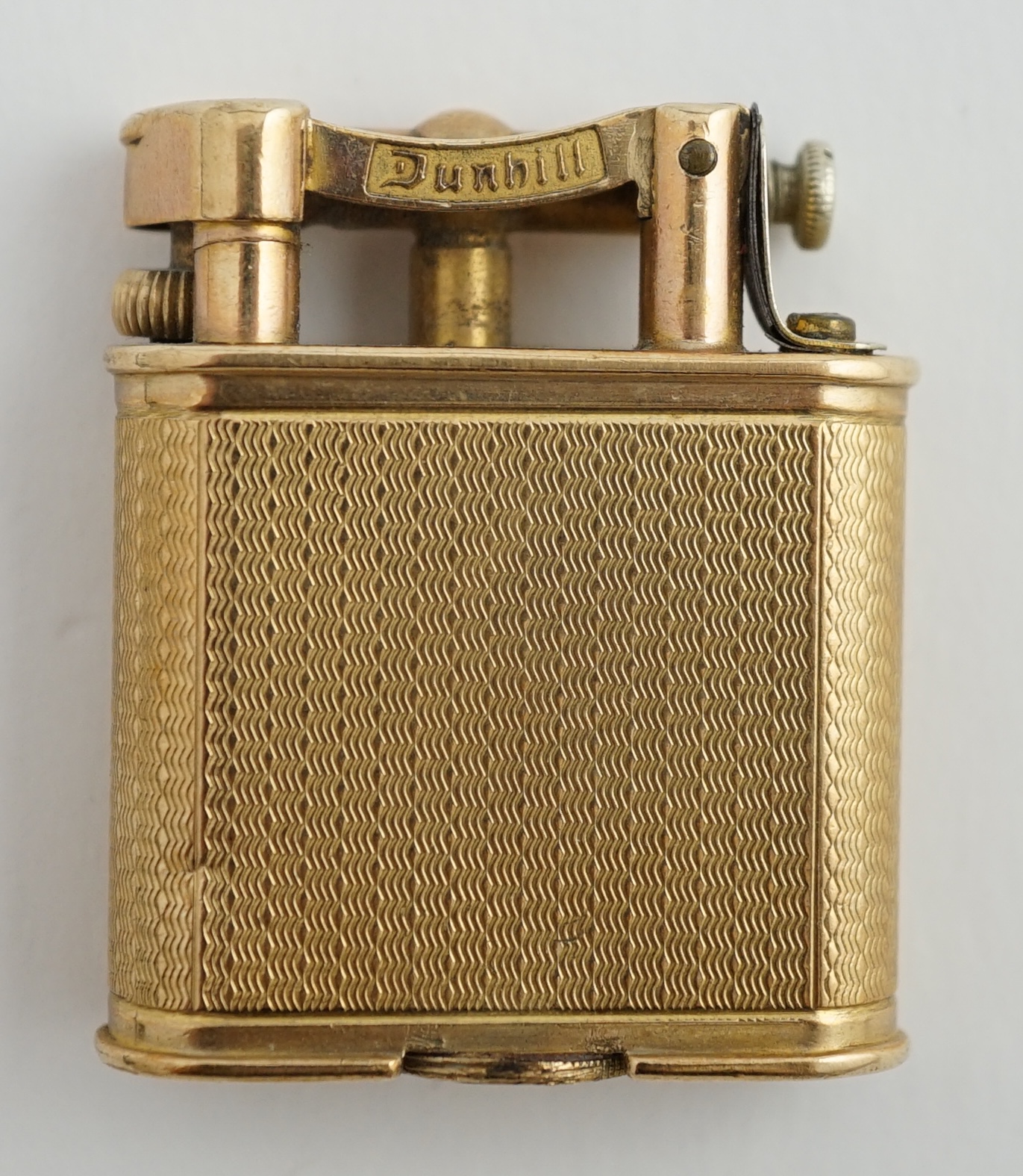 A George V engine turned 9ct gold cased Dunhill lighter